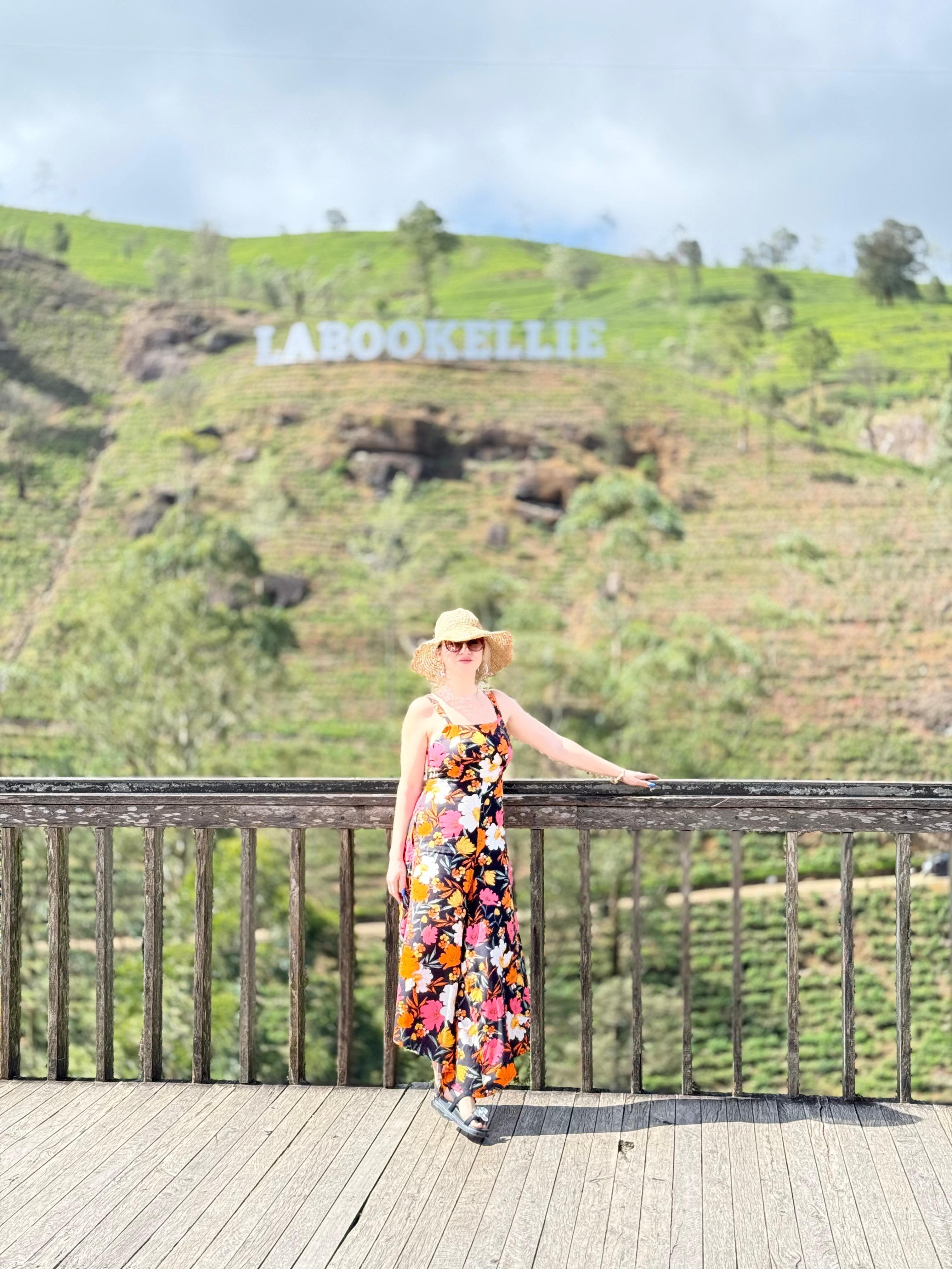 Woman in a floral dress in the tea hills