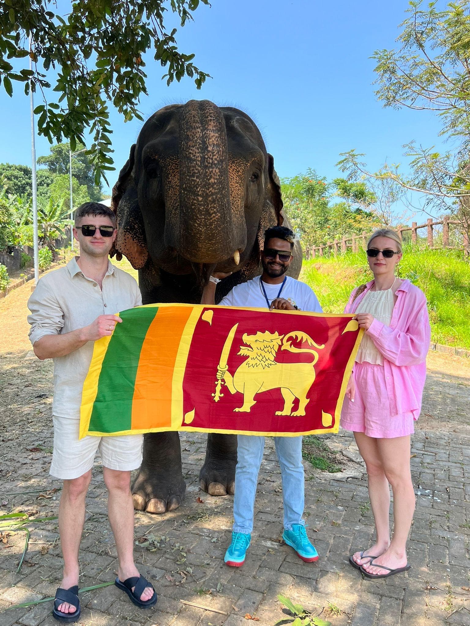 Friends with an elephant and the Sri Lanka flag