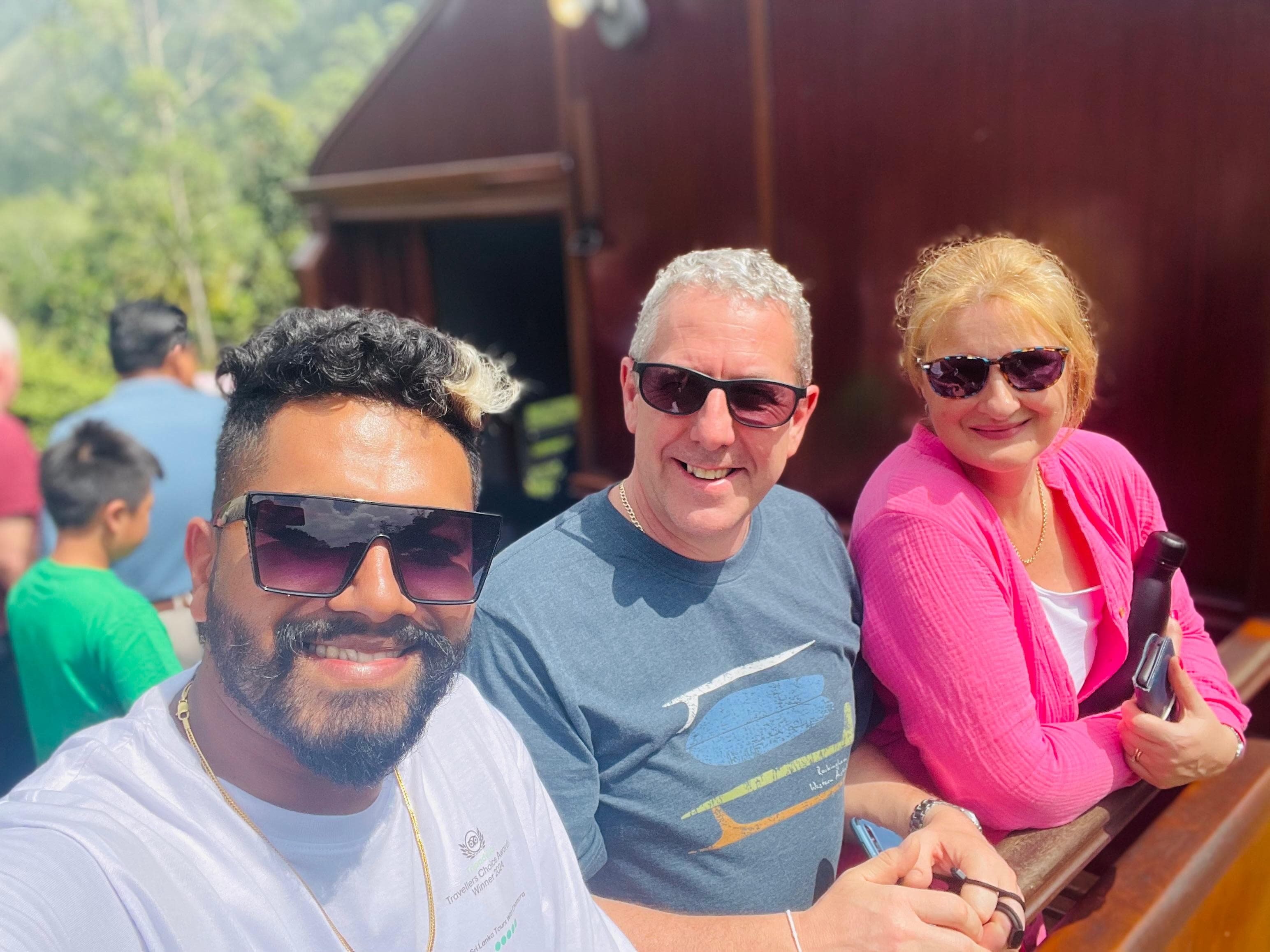Guide and couple taking a selfie on the train