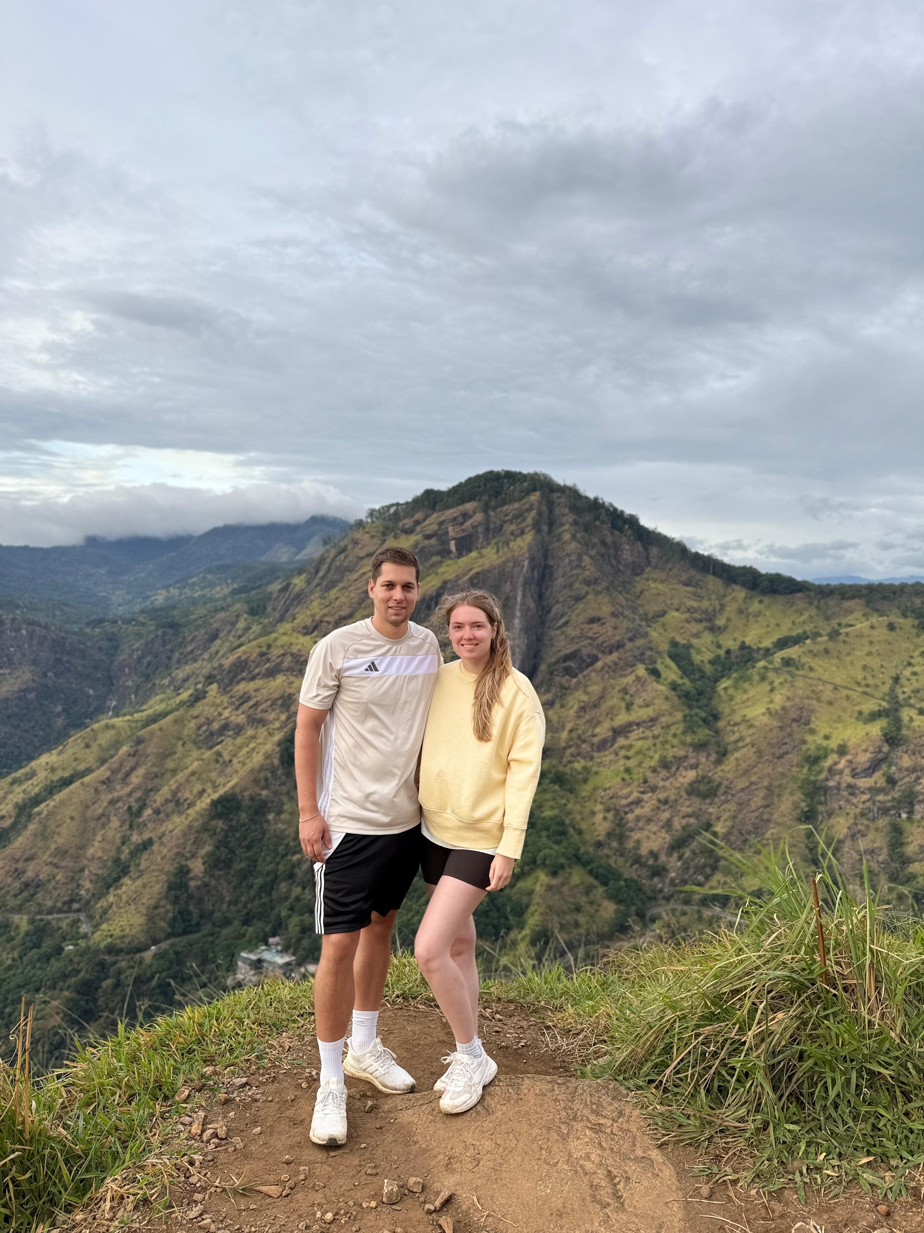 Couple at a mountain ridge viewpoint