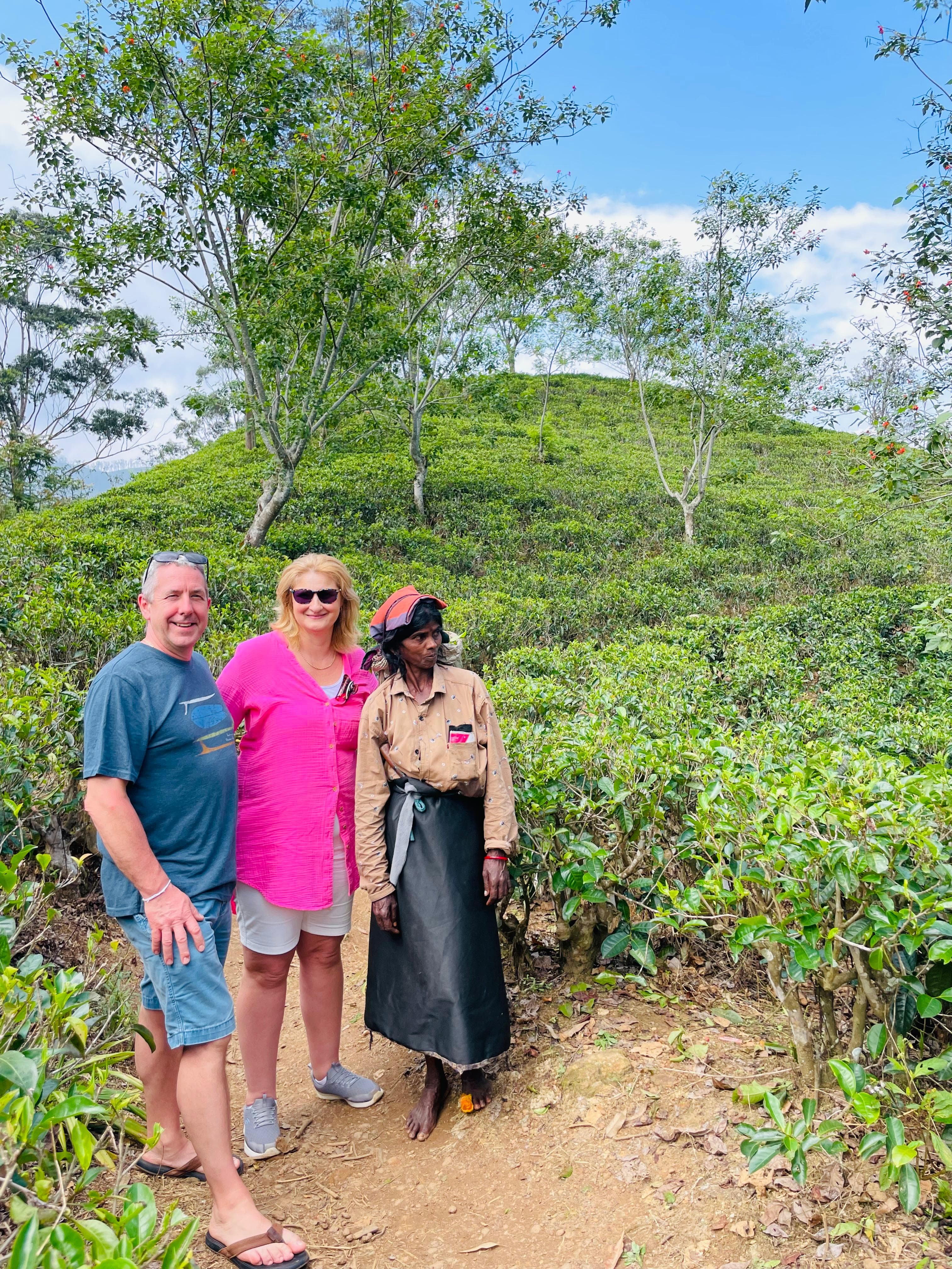 Couple with a tea plantation worker and guide