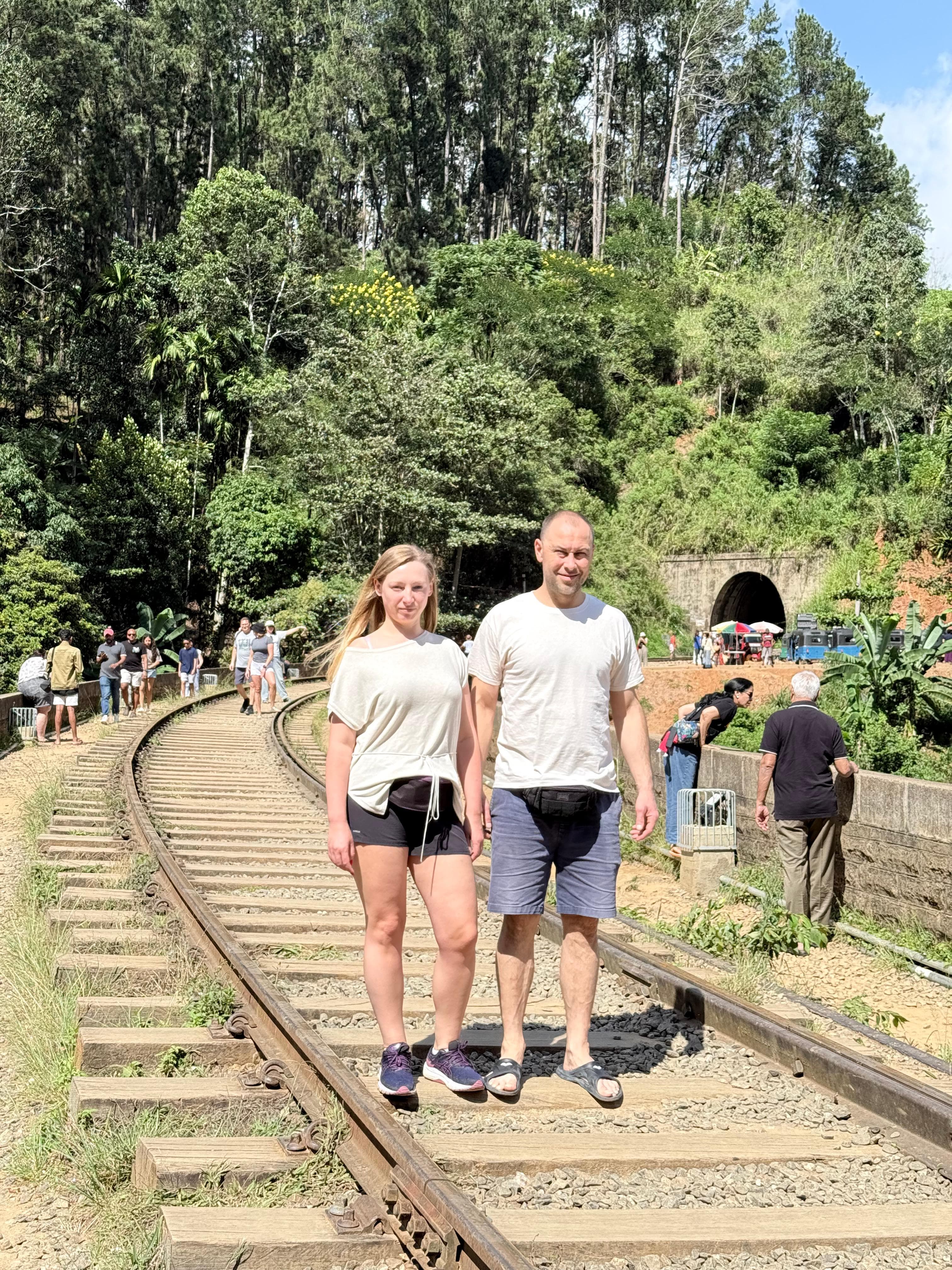 Couple on the railway track near a tunnel