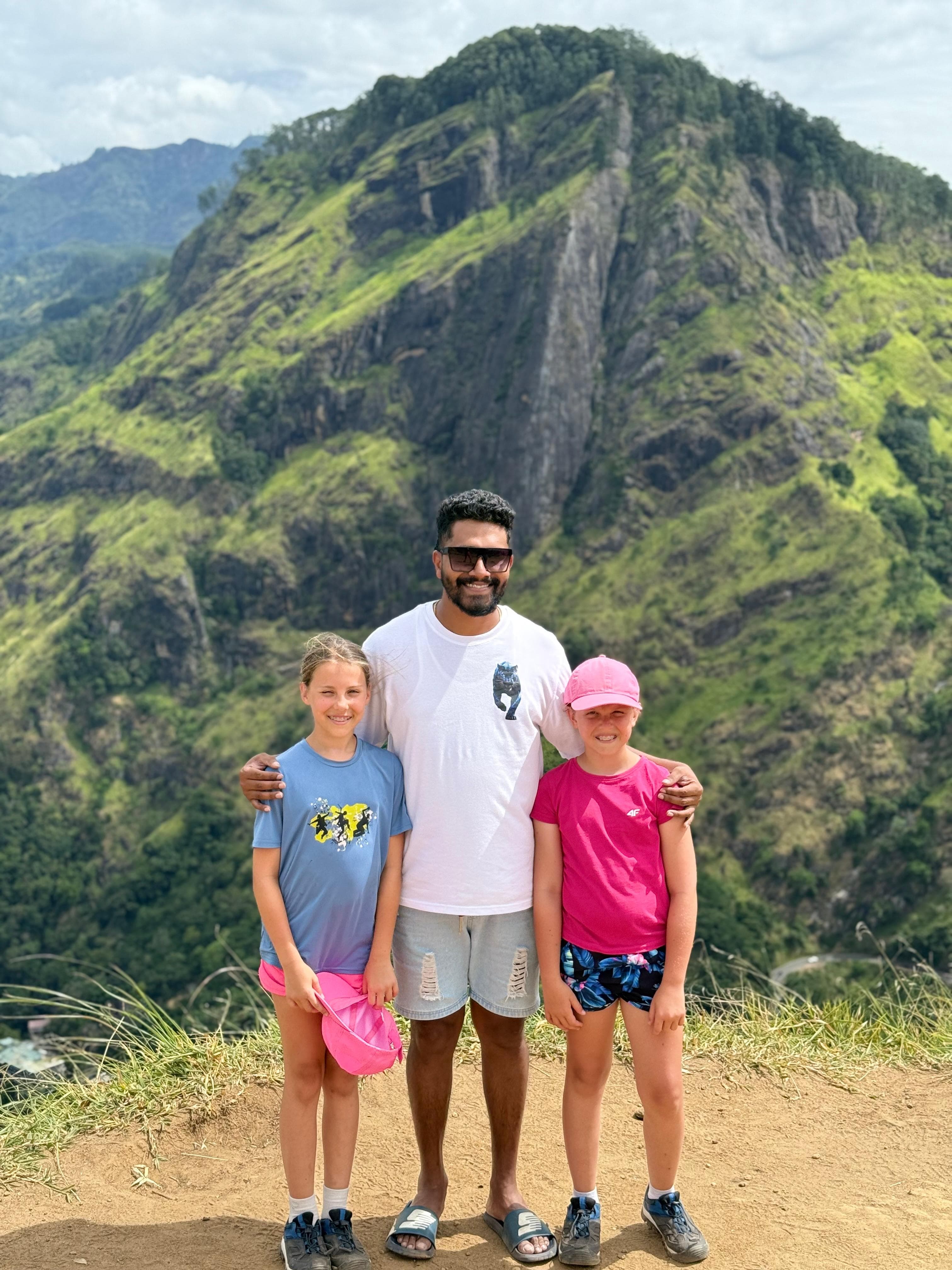 Guide with guests at a mountain viewpoint