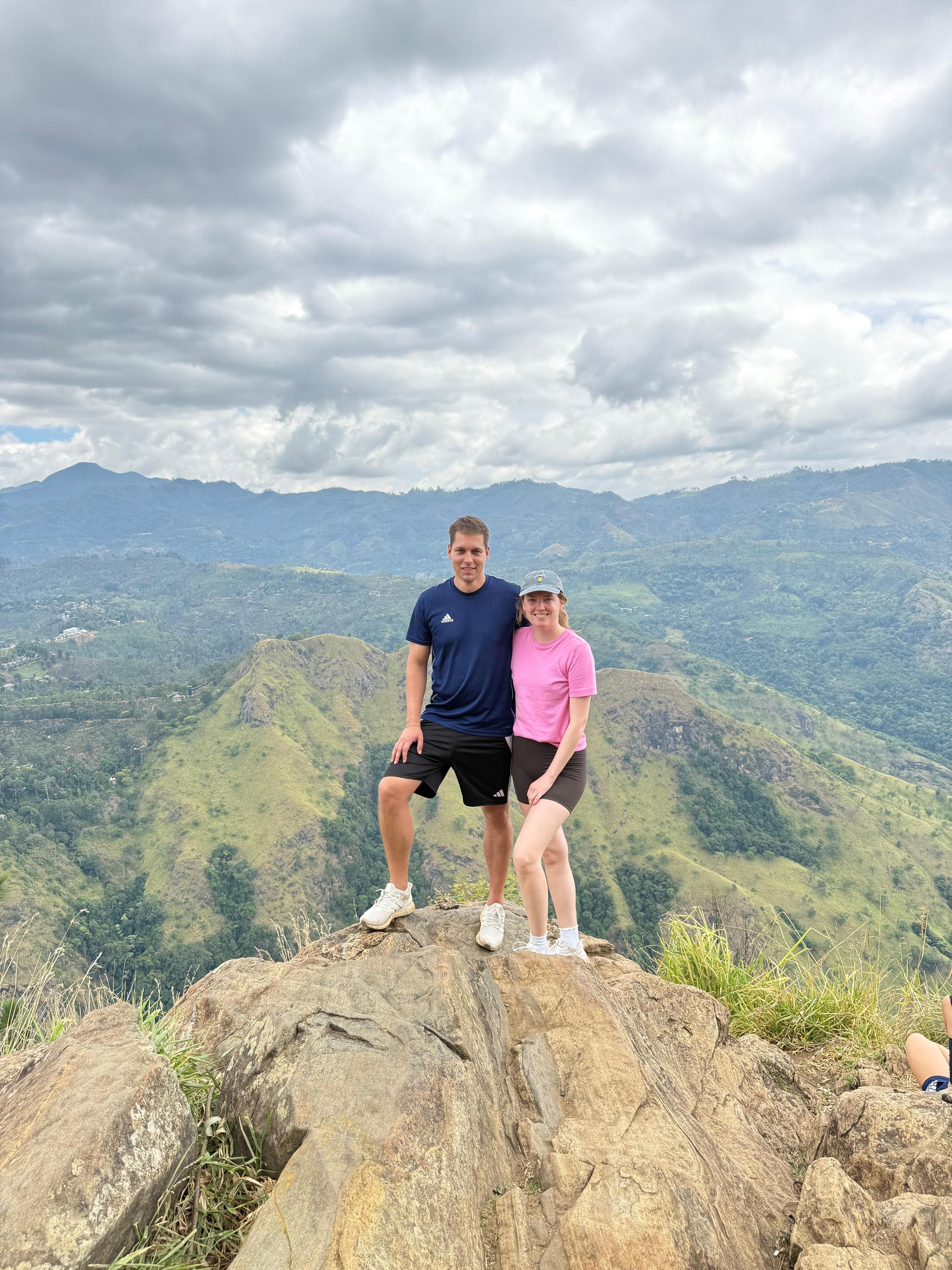 Couple at a mountain peak viewpoint
