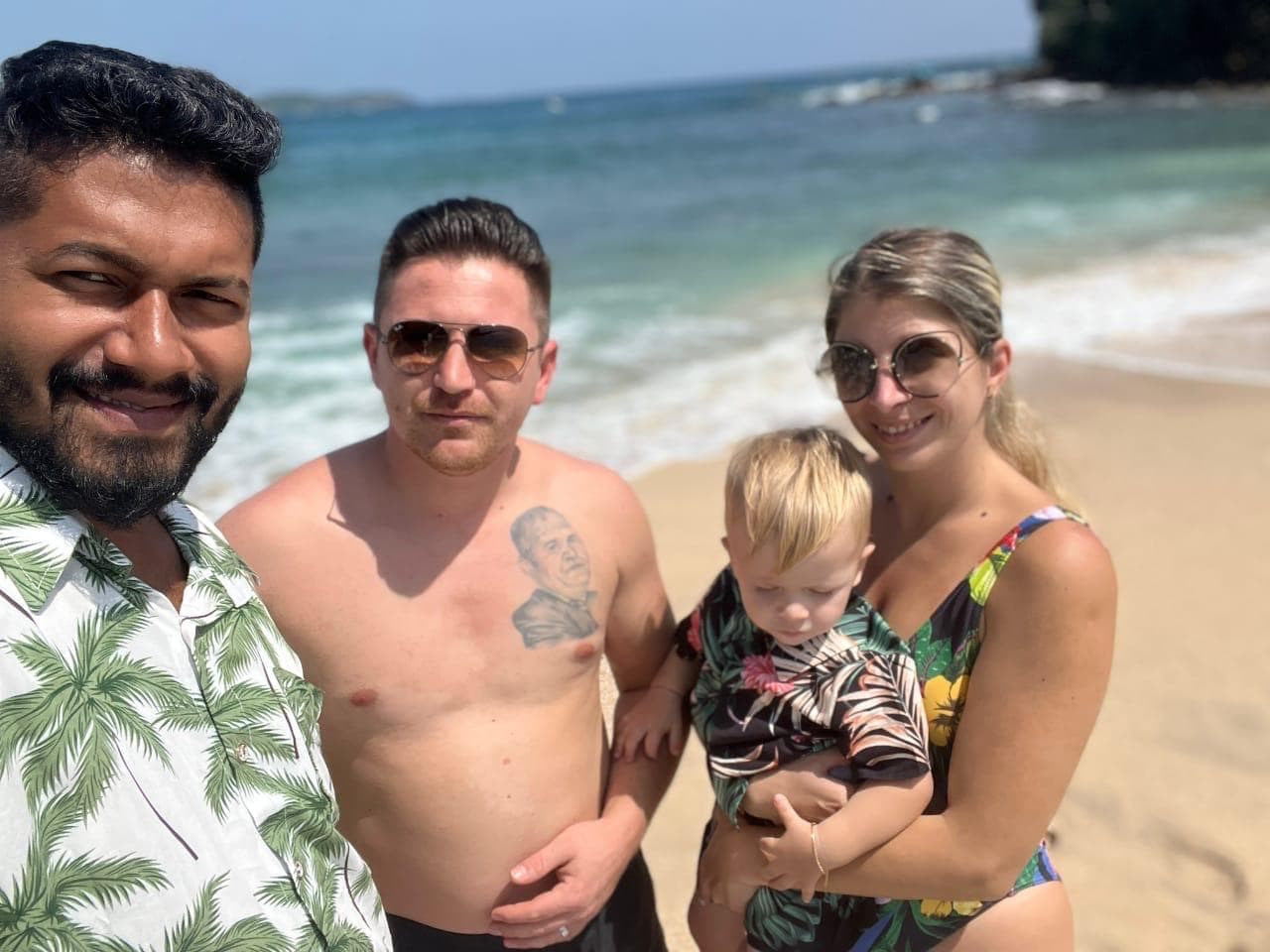 Family group portrait on the beach