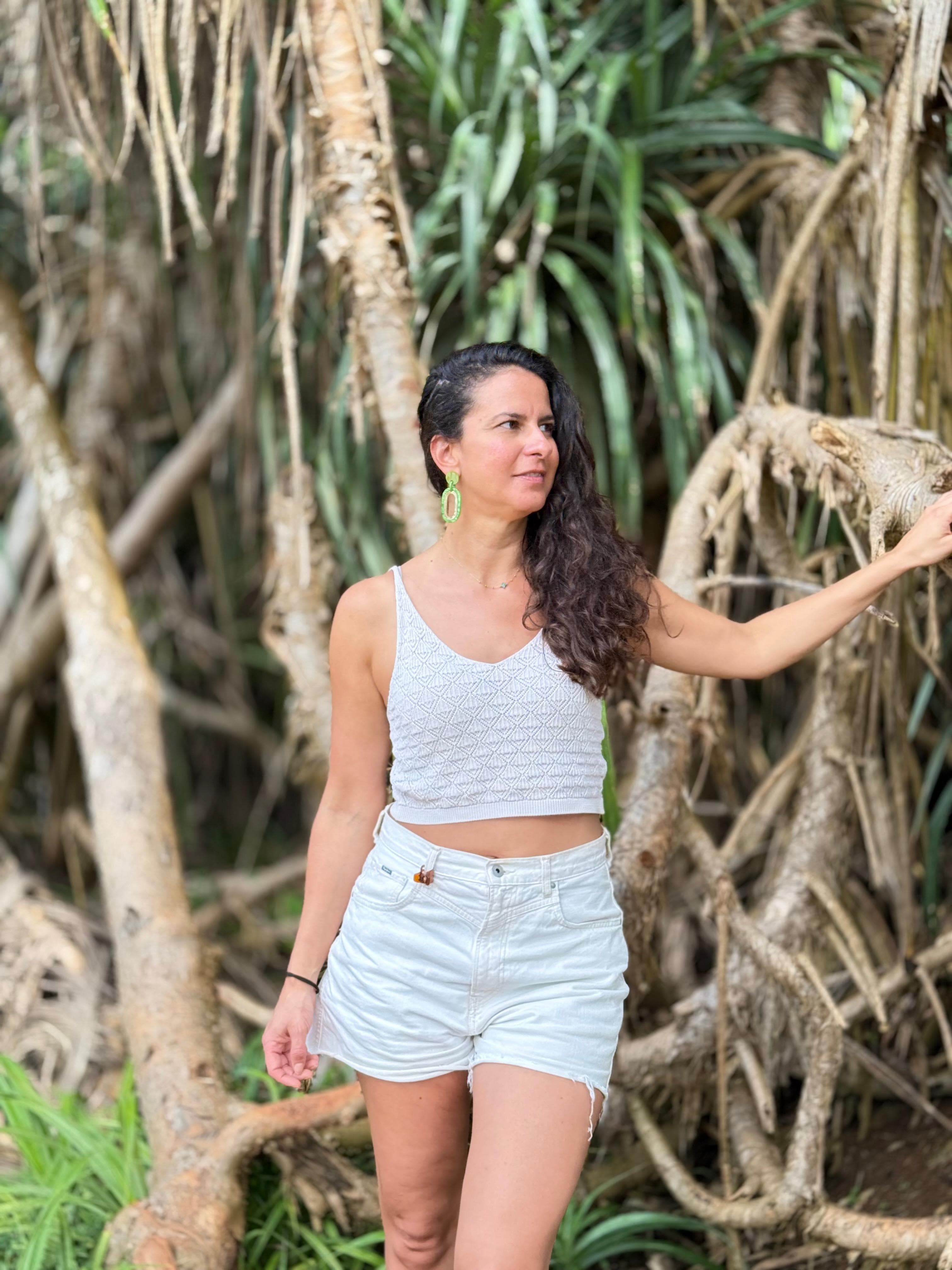 Woman portrait among mangrove roots in the jungle