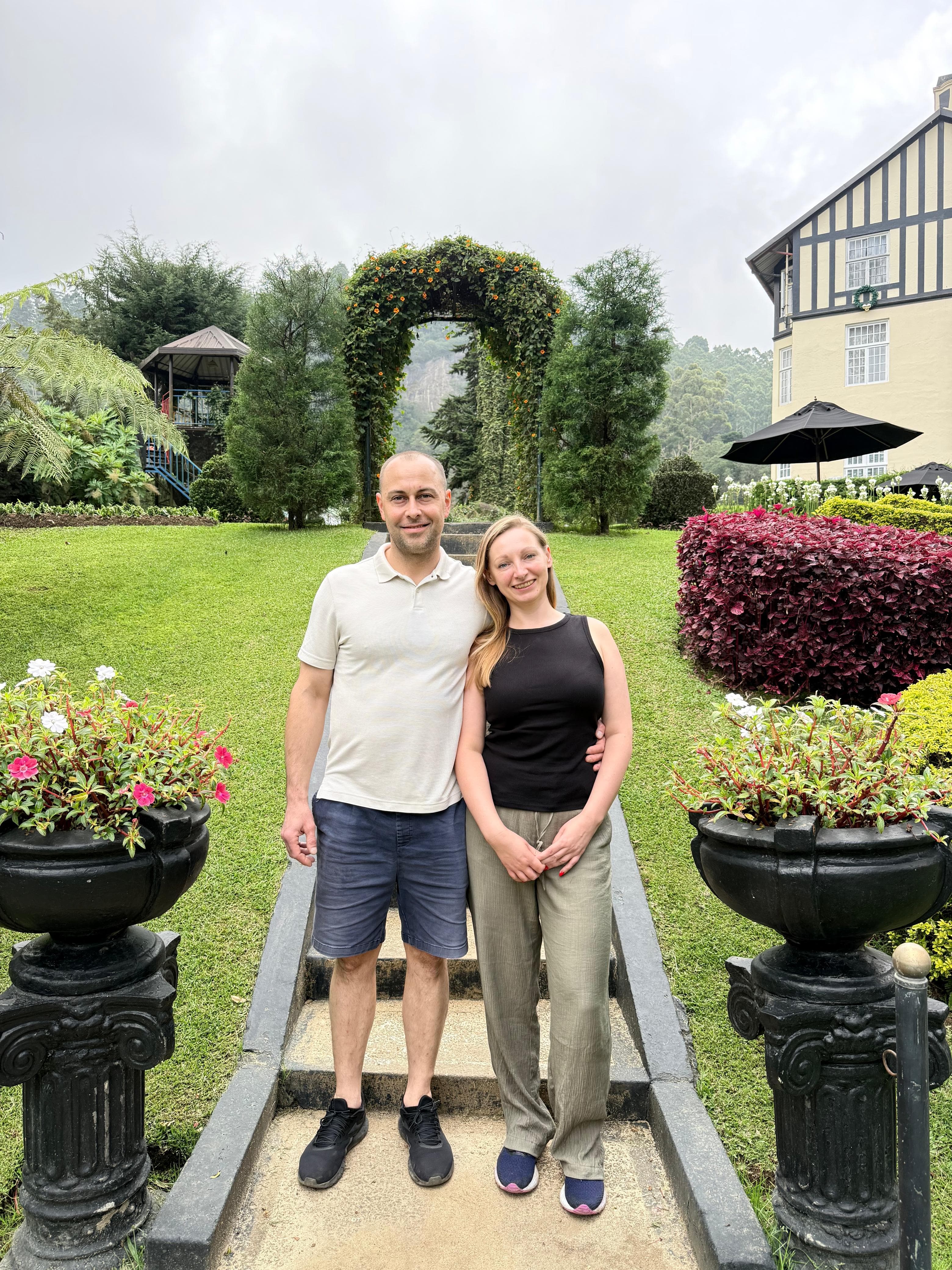 Couple portrait under a garden archway