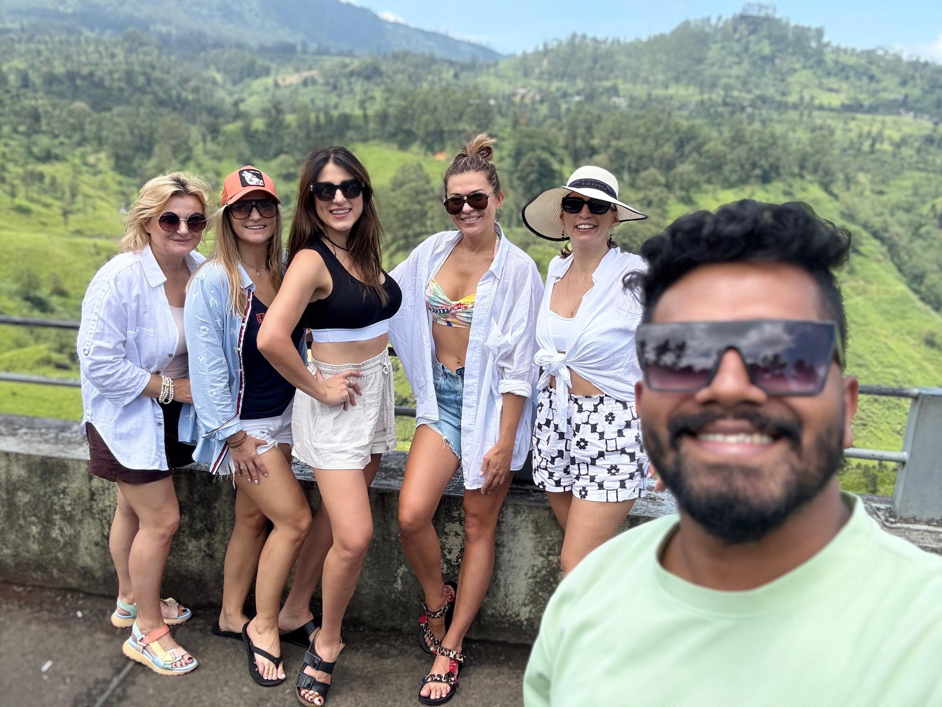 Guide with a group of women at a tea hills viewpoint