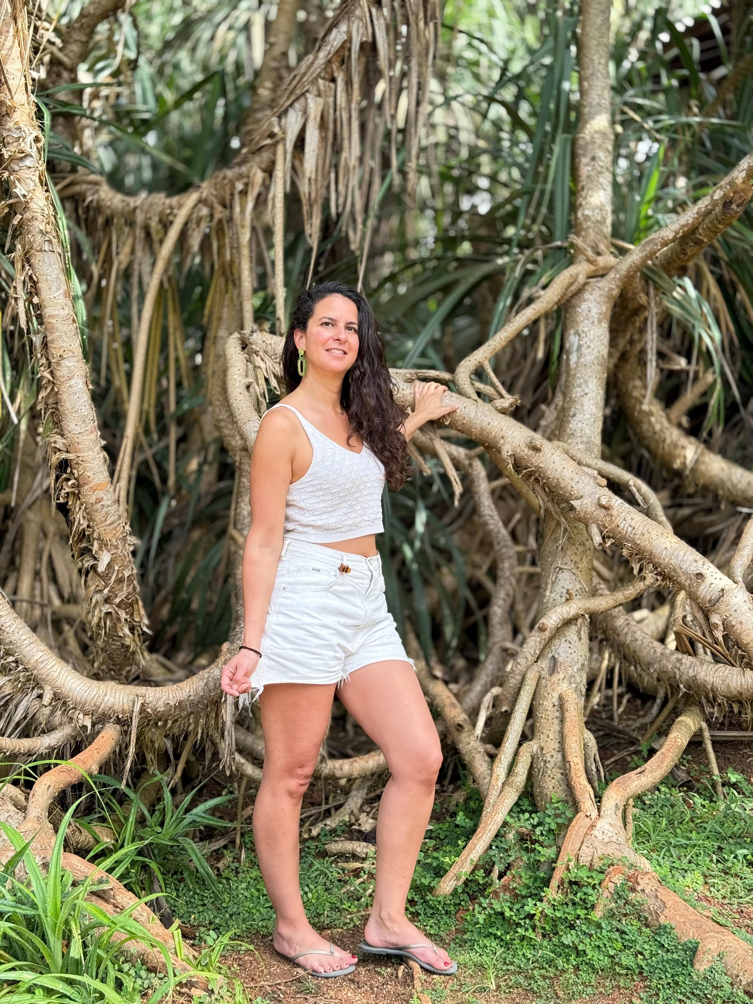 Woman portrait among jungle tree roots