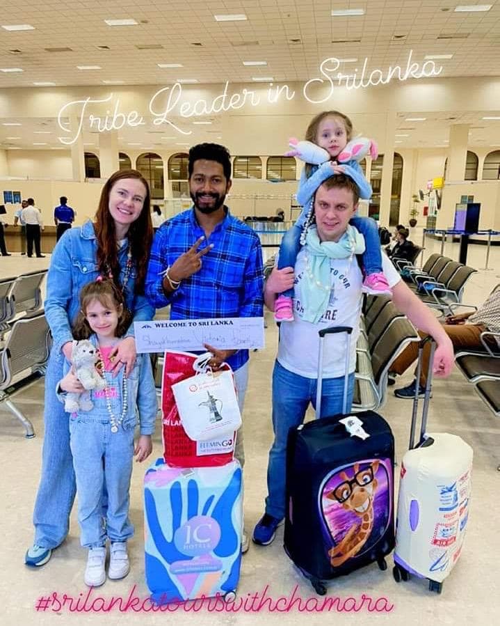 Family at the welcome to Sri Lanka airport sign