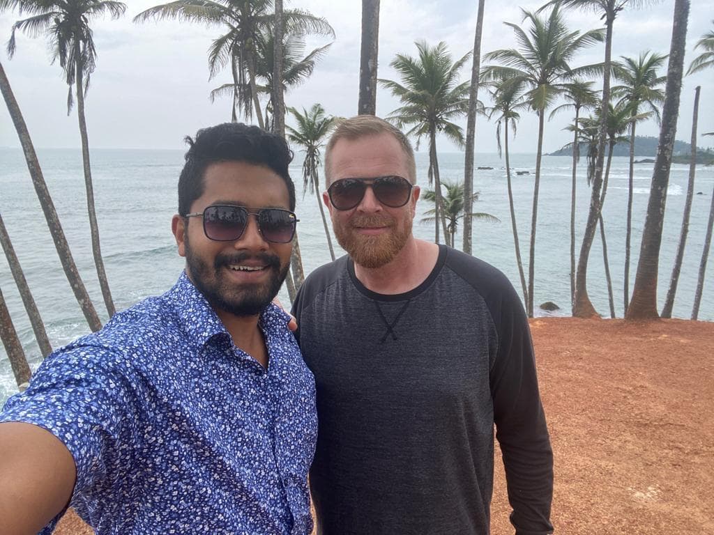 Guide and guest selfie on a coastal bluff