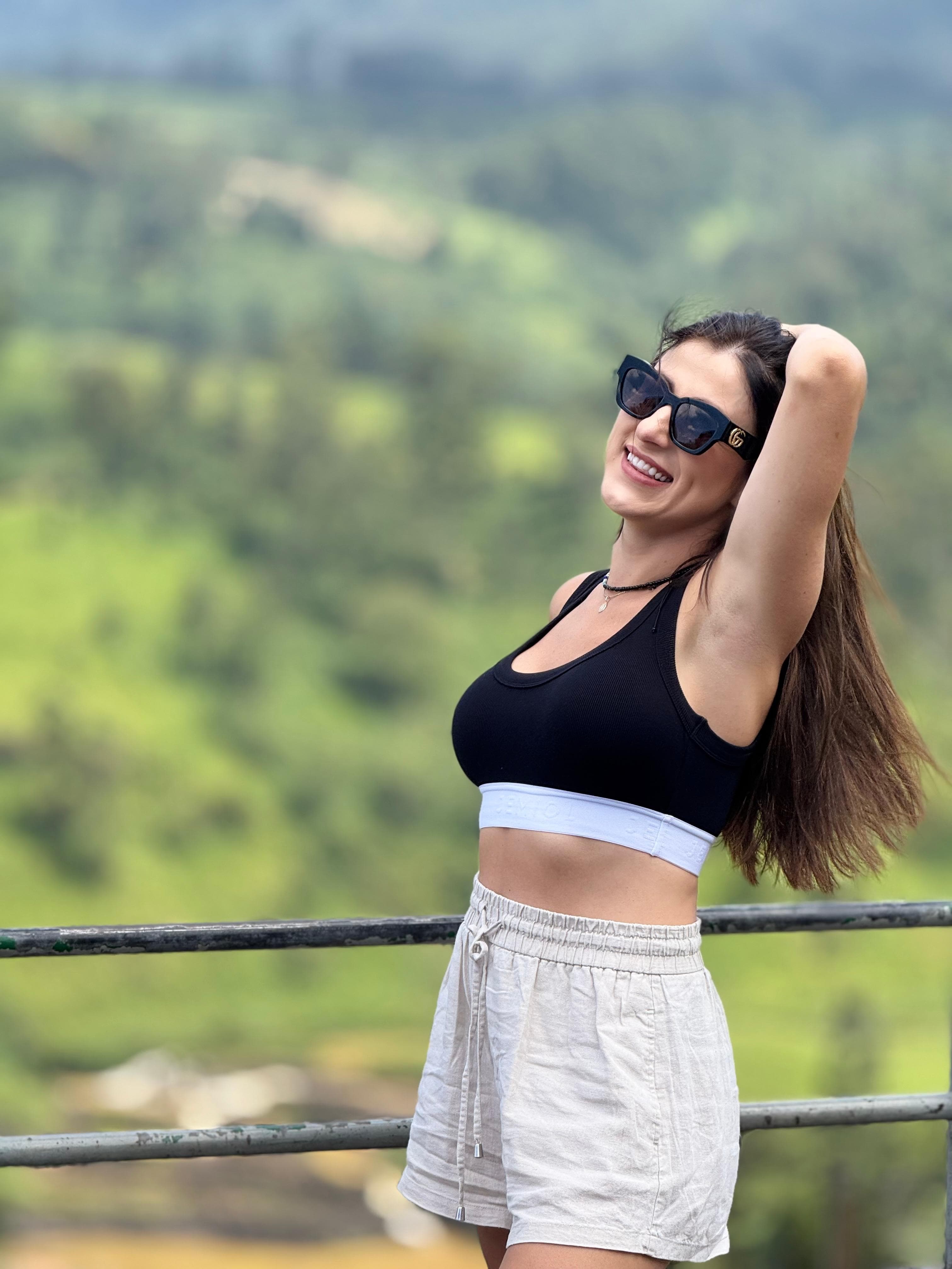 Woman at a hill country viewpoint railing