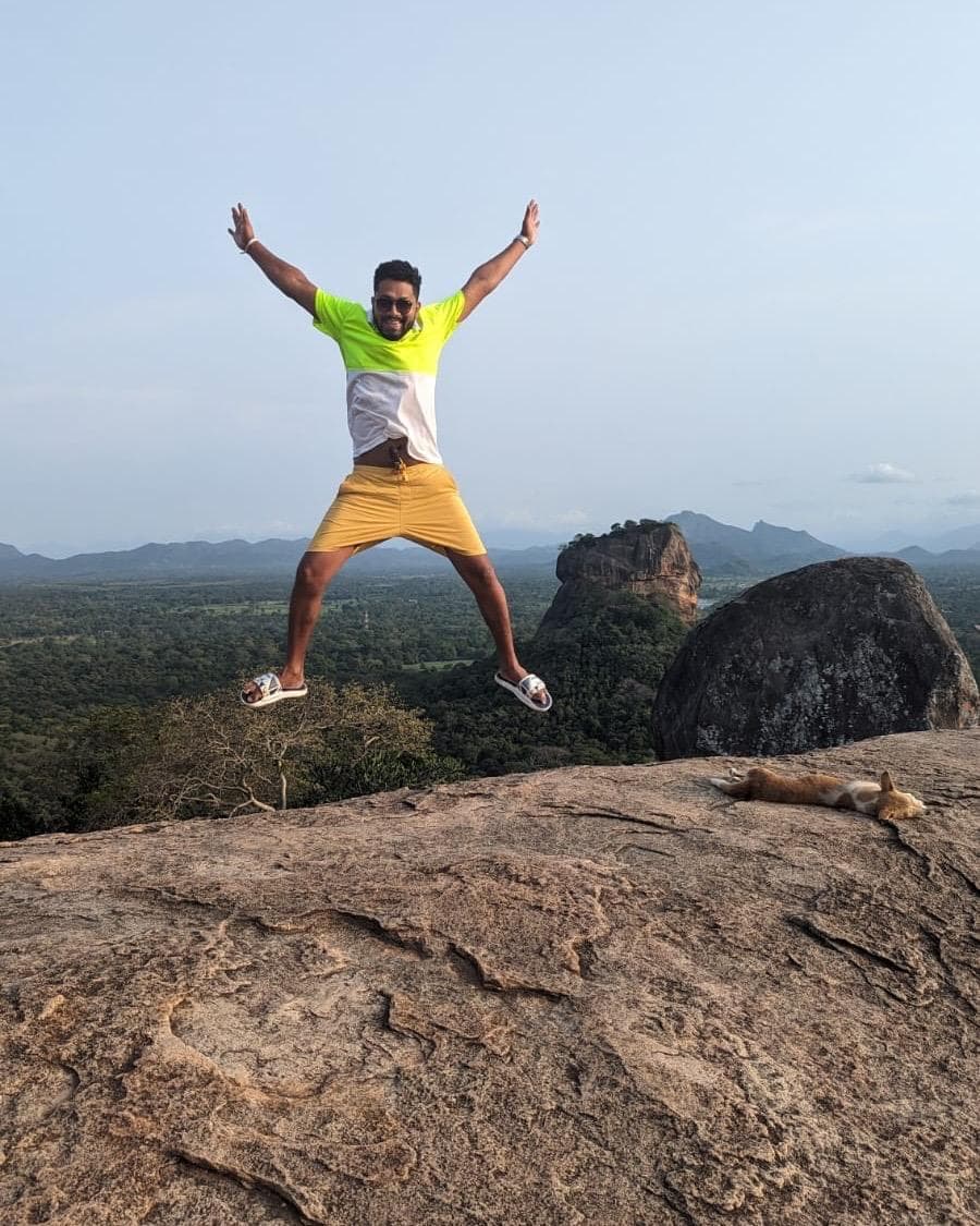 Man jumping on Pidurangala Rock near Sigiriya