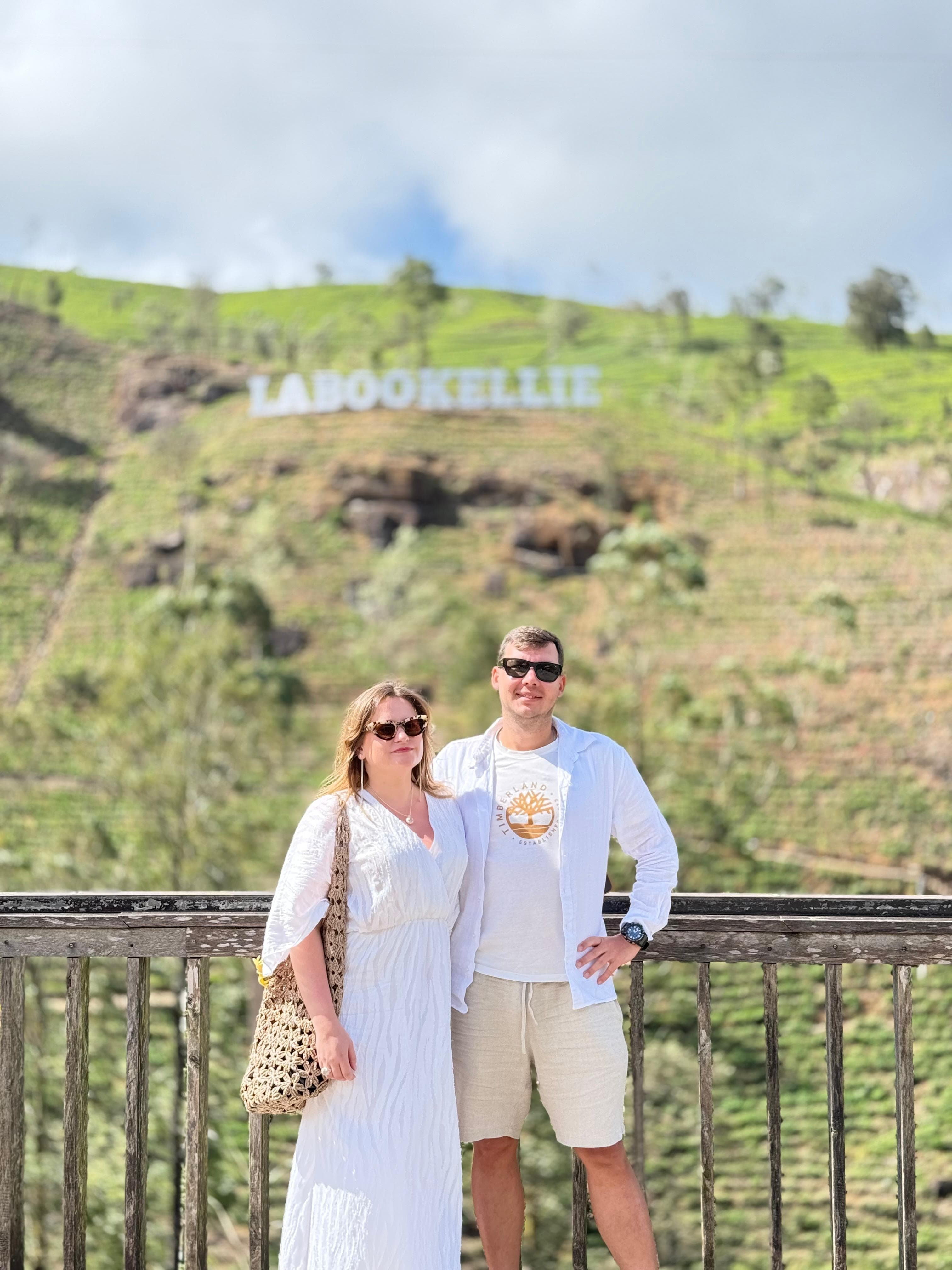 Couple at the Labookellie tea plantation sign