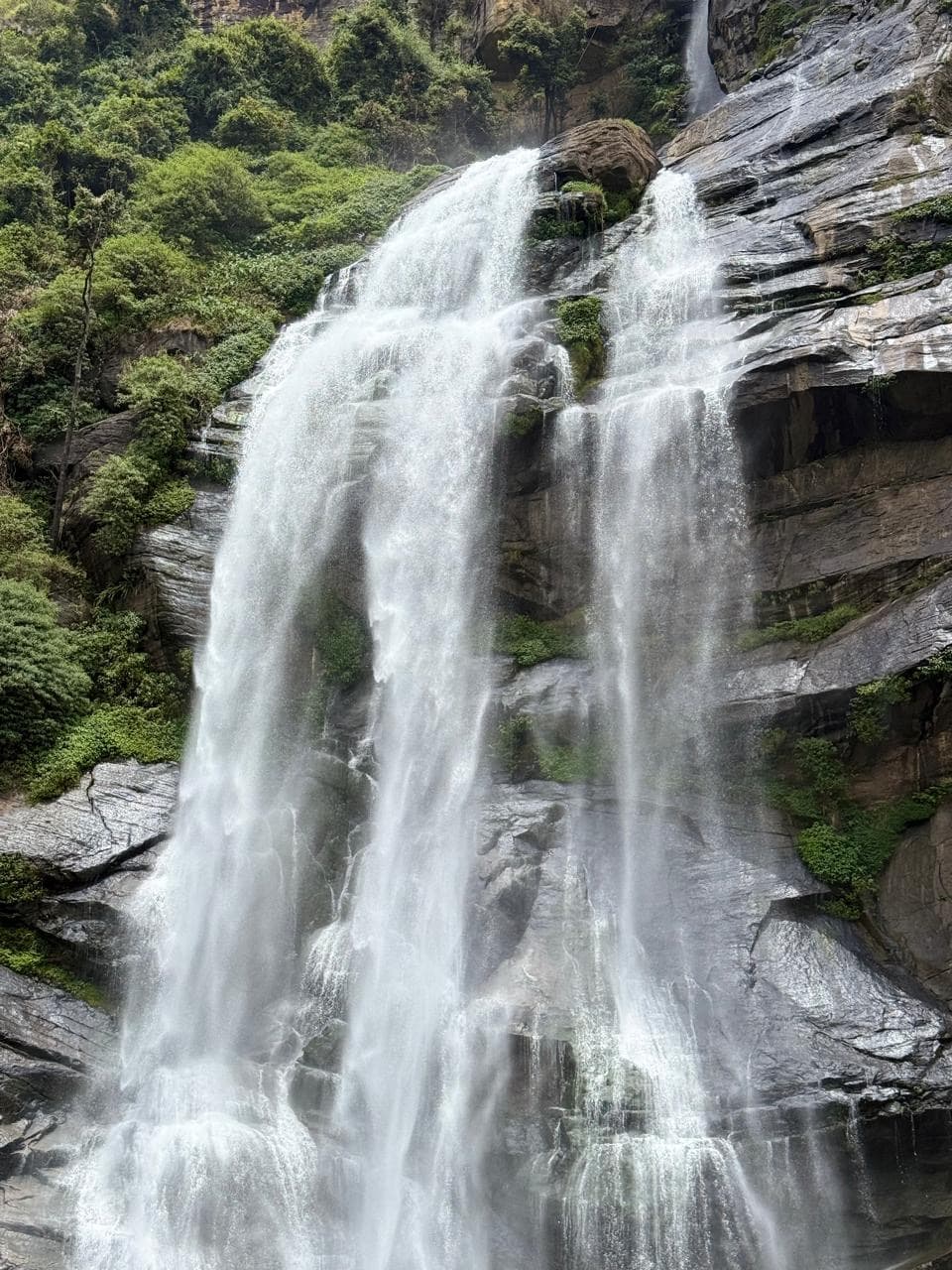 Close-up of a cascading waterfall on a rocky cliff