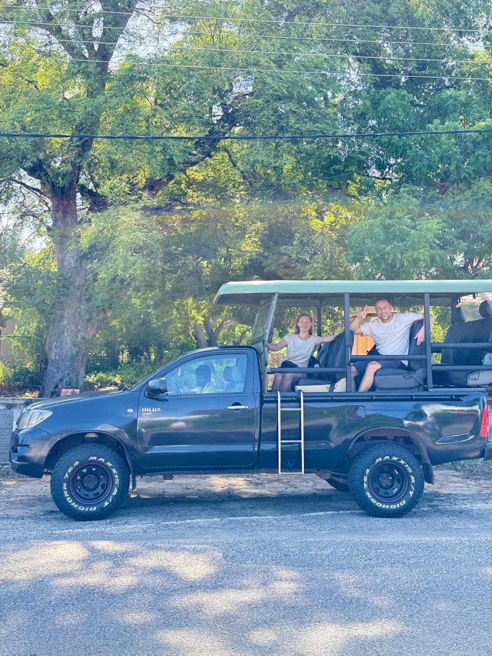Couple portrait beside the safari truck