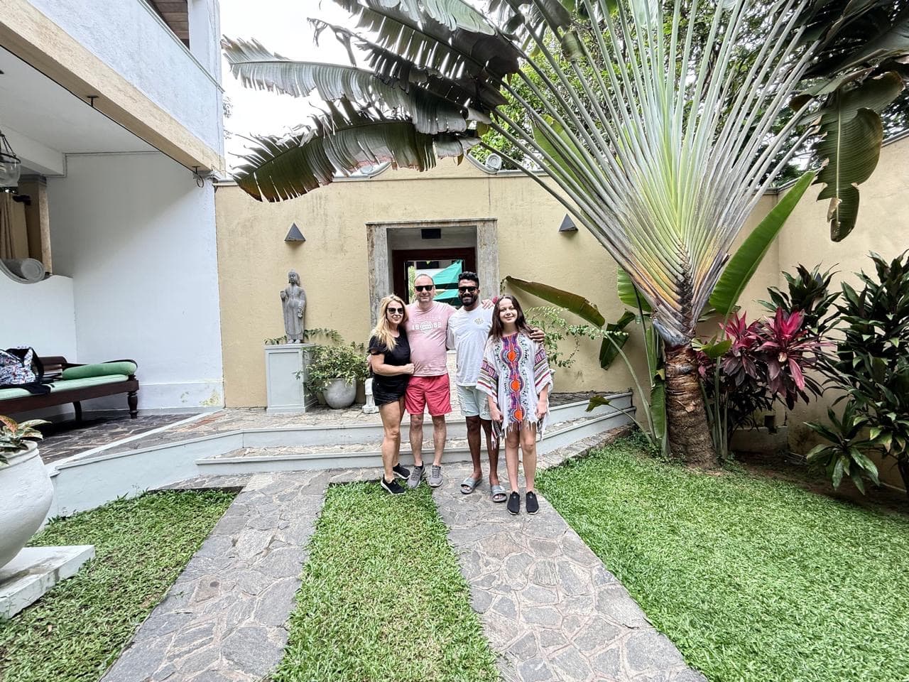 Family and guide portrait in a villa garden