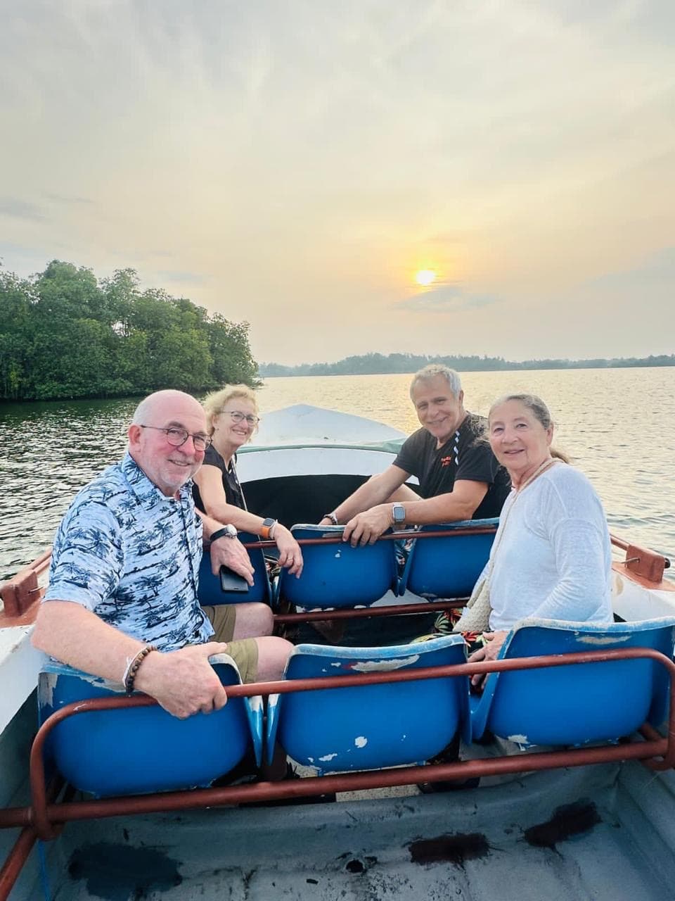 Guests on a lake boat portrait at sunset