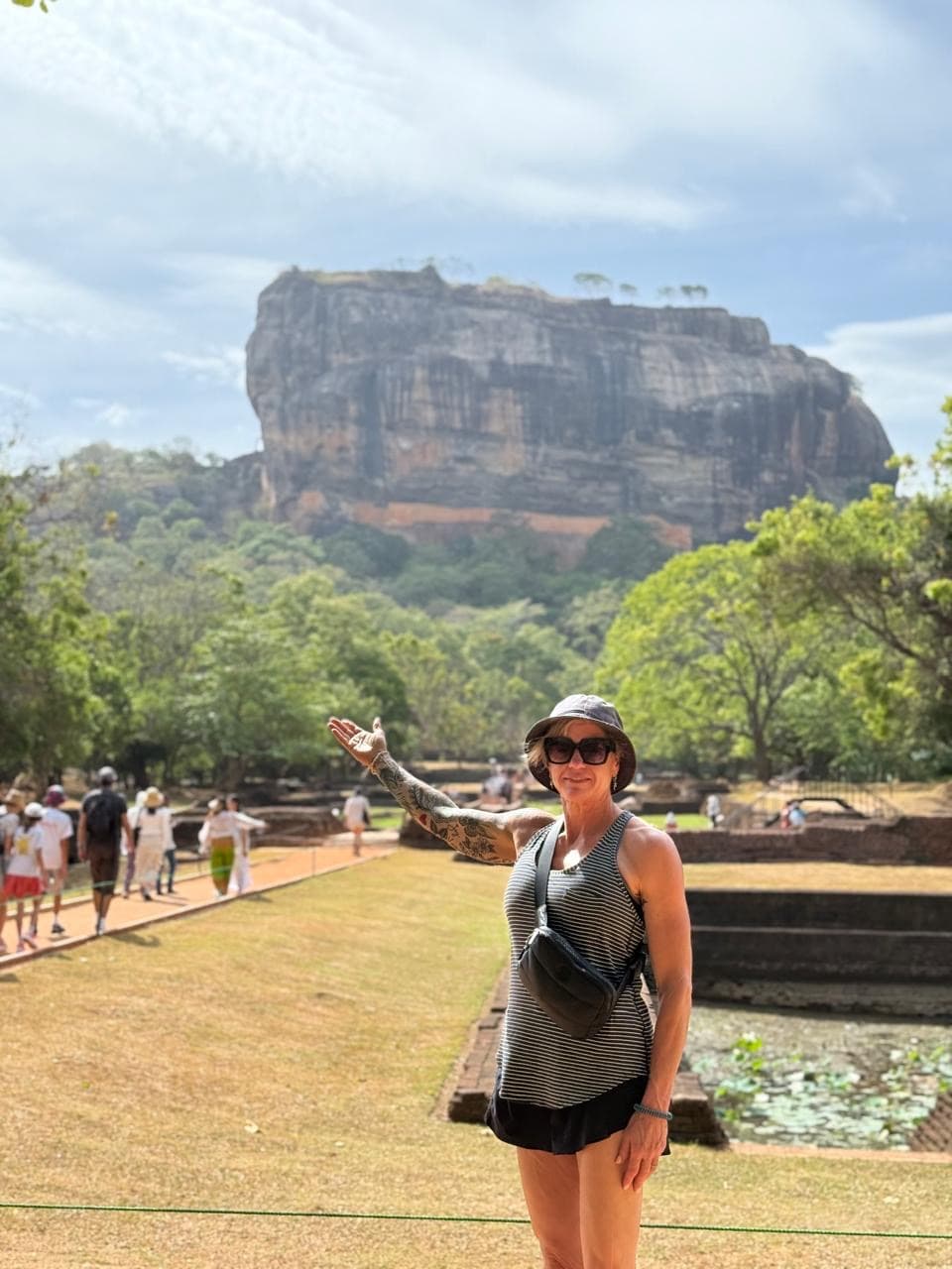 Woman with a garden view of Sigiriya rock